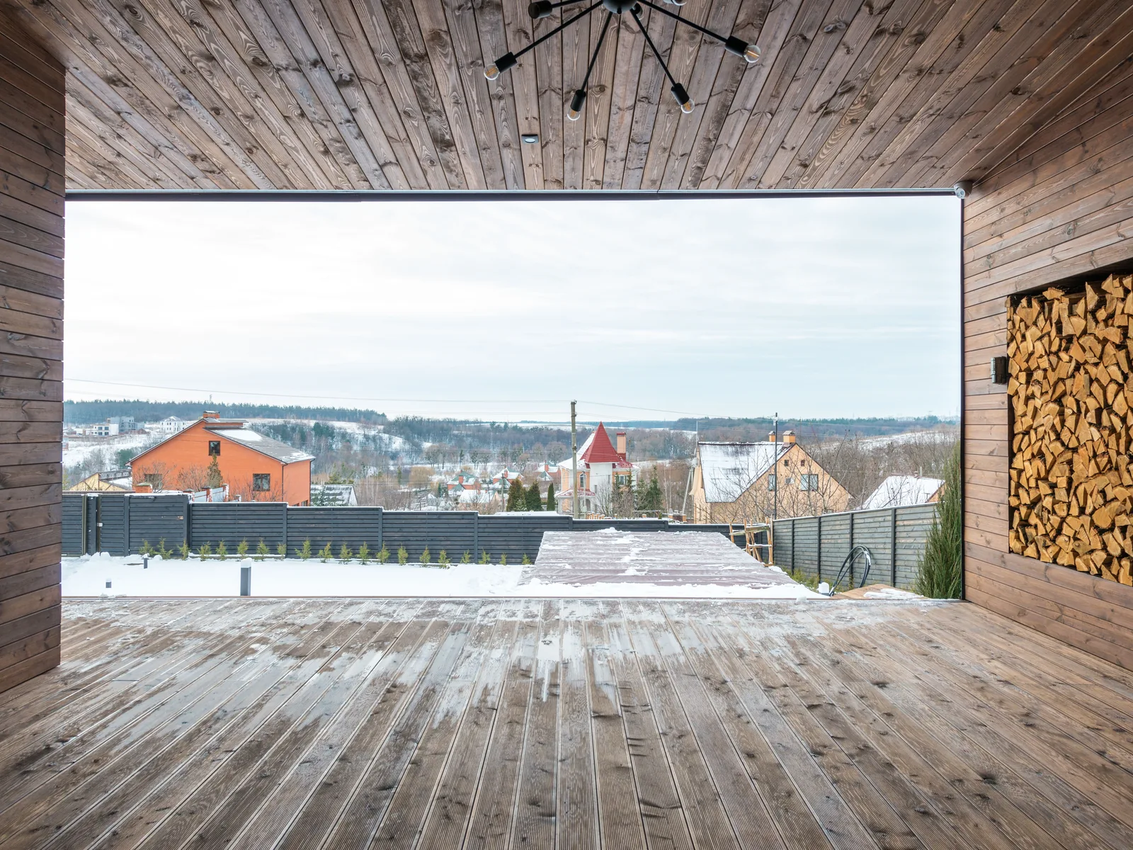 Wood deck overlooking a snowy landscape
